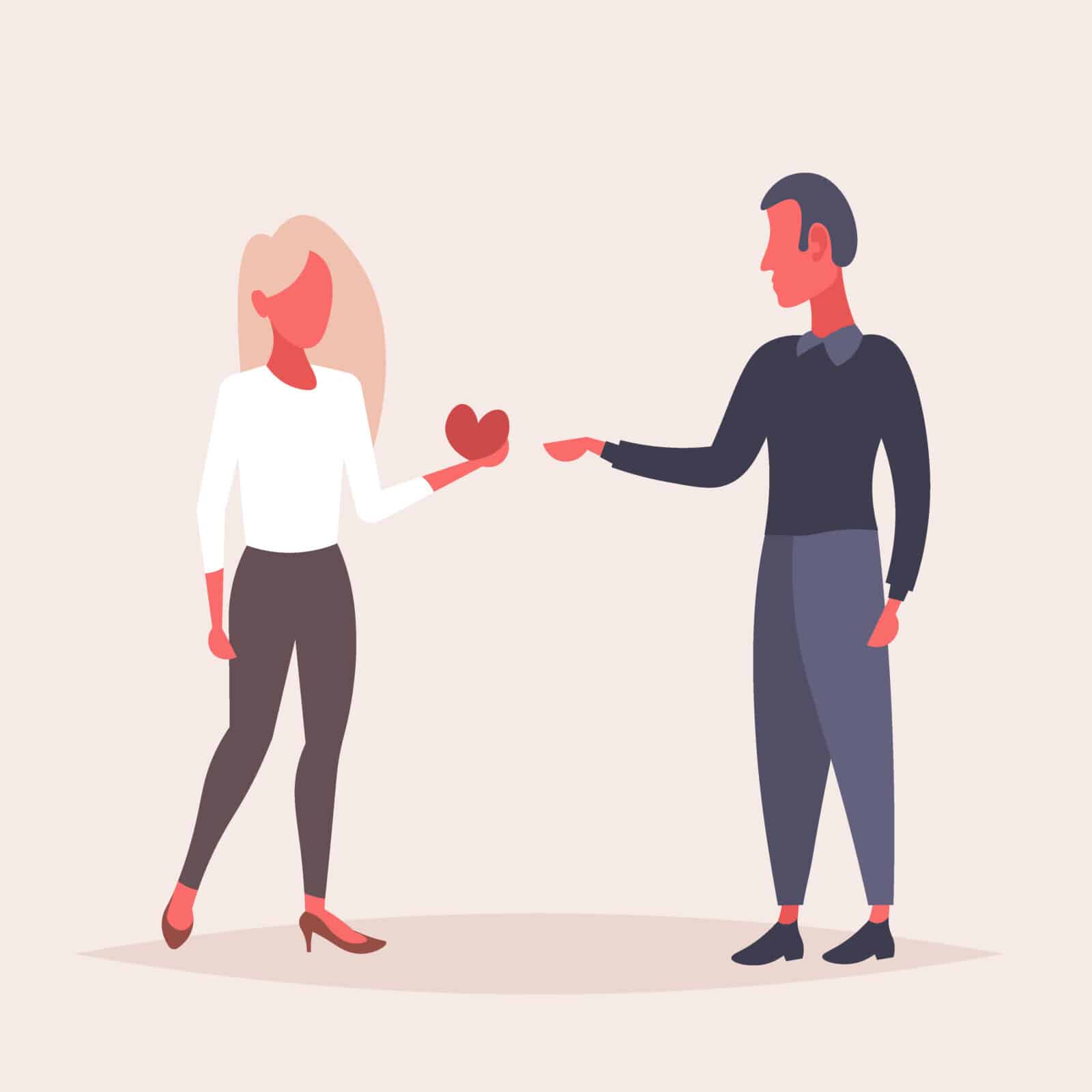 A woman hands a heart to a man she is getting back together with.