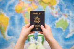 A child holds a passport in his hands,