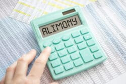 A calculator with the word Alimony on the display