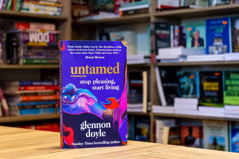 Close up of Glennon Doyle's Untamed: Stop Pleasing, Start Living book in the bookshop.