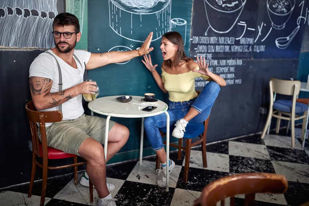 Modern couple having a fight in a cafe