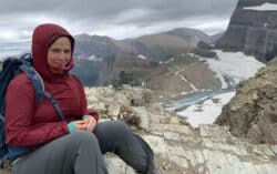 Tea Rozman takes a break while hiking Glacier National Park