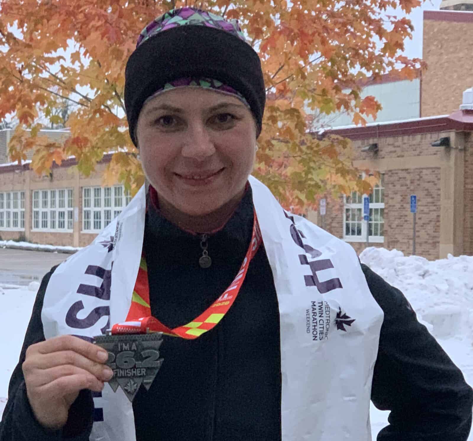 Tea Rozman with her medal after running a marathon